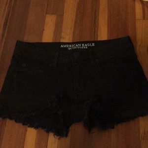 Distressed black jean shorts